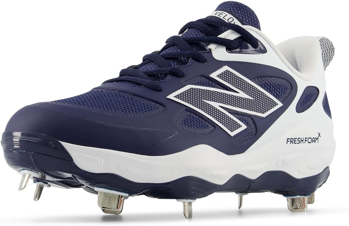 Installing New Balance Women's Softball Cleats on a wooden desk